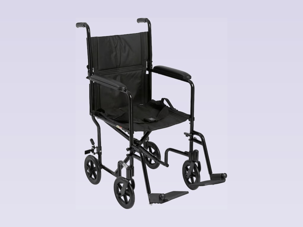 Lightweight black folding transport chair with push handles and footrests